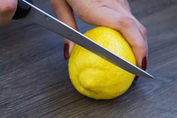 Female Hands Cut Lemon Pieces Wooden Board — Stock Photo, Image