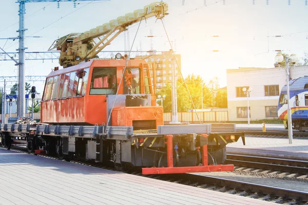 motor transport for loading and unloading on railway tracks.  The trucks are at the railway station