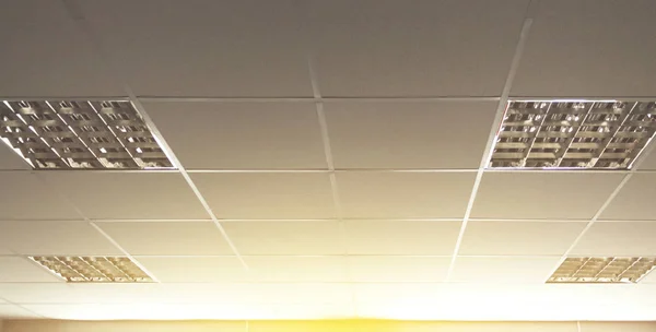 Background of the ceiling in the office with fluorescent lights