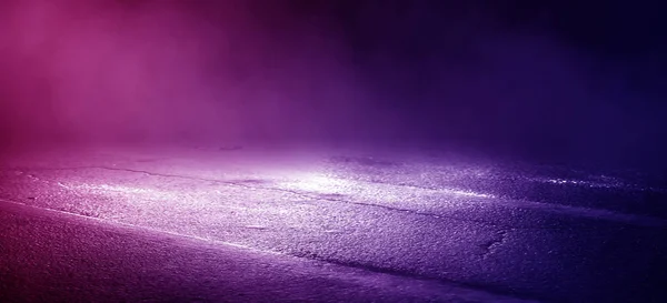 The background of wet asphalt, the reflection of the night lights of the city, neon light, smoke