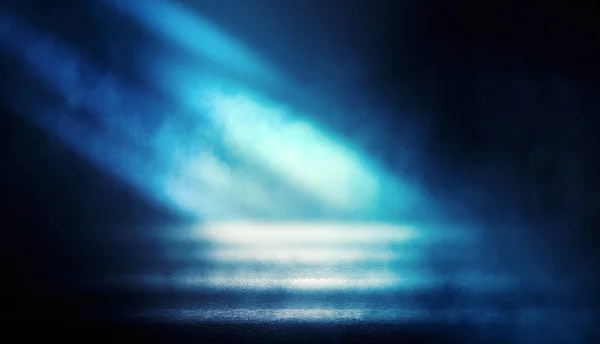Background of empty dark room with rays of light. Concrete floor with light reflection. Smoke, neon blue light