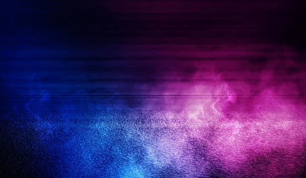 Background of empty wooden wall and concrete floor. Spotlight light, blue and pink neon light, smoke