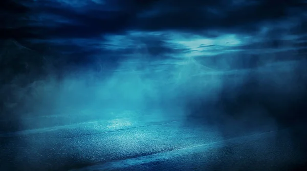 Background scene of empty street. Night view of the river, the night sky with clouds, a reflection of light on the asphalt. Smoke fog