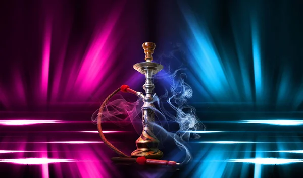 Hookah, smoke on a dark abstract background. Background of empty scenes with multicolored neon lights, reflection of night lights on wet pavement