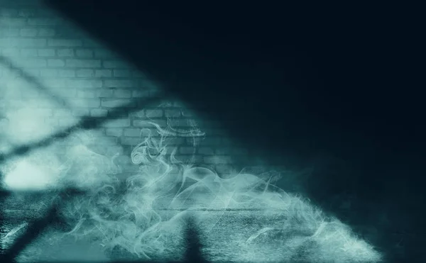 Empty scene background. Incident light from a window on an empty brick wall. Dark abstract background