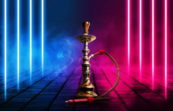 Hookah, smoke on a dark abstract background. Background of empty scenes with multicolored neon lights, reflection of night lights on wet pavement