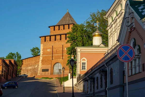 Street, at the end of which the tower of the ancient Kremlin and the Orthodox Church. Ancient fortification at the end of the street.