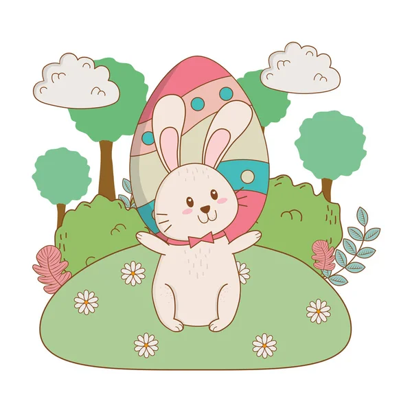 Little rabbit with egg painted in the garden — Stock Vector