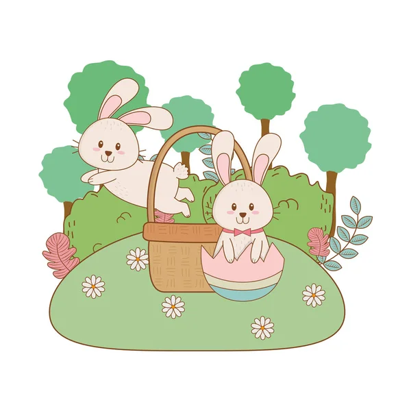 Маленькие кролики с яйцом окрашены в саду — стоковый вектор