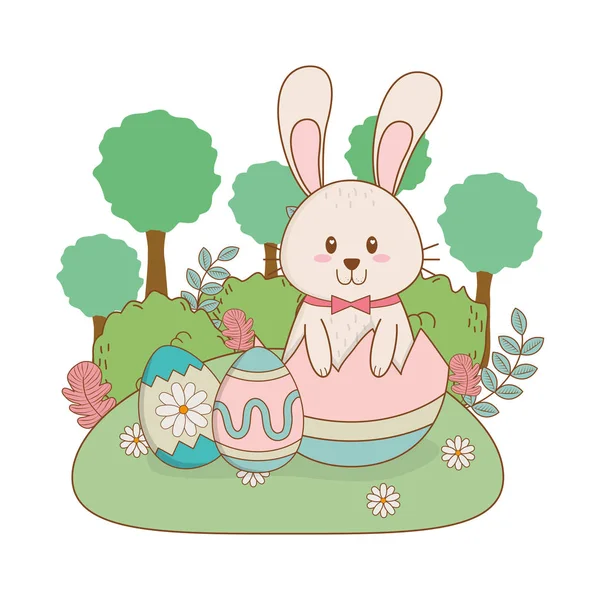 Petit lapin aux œufs peints dans le jardin — Image vectorielle