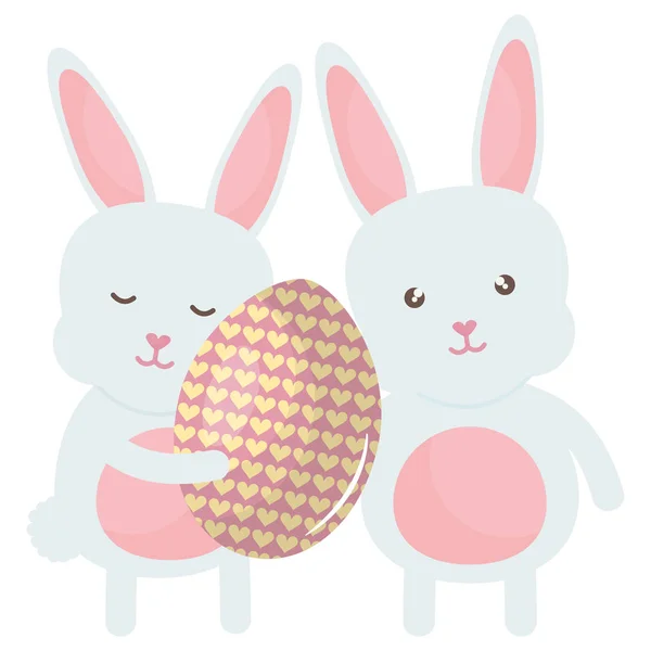 Cute rabbits with easter egg painted — Stock Vector