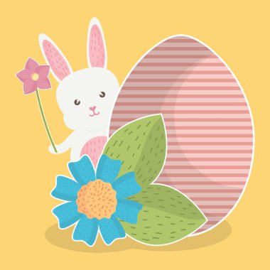 Paskalya yortusu yumurta boyalı ve çiçeklerle sevimli tavşan