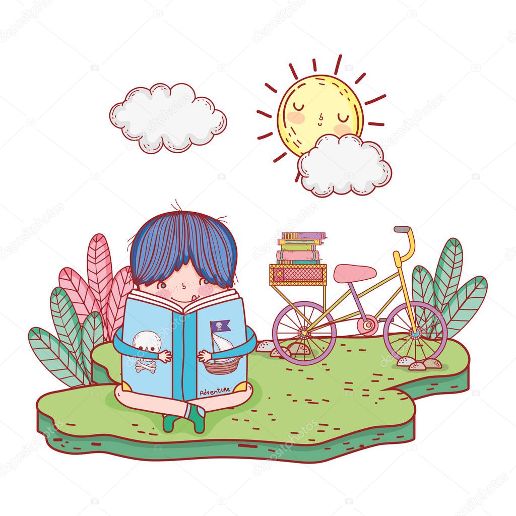 happy little boy reading book with bicycle in the field