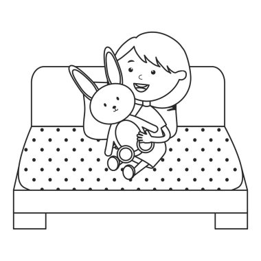 yatakta doldurulmuş tavşan ile sevimli küçük kız