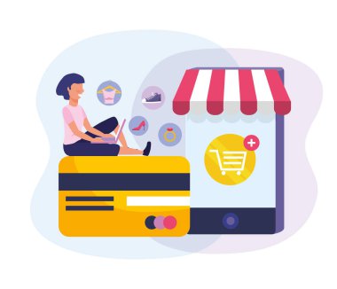 Bilgisayarı ve akıllı telefon teknolojisiyle internetten alışveriş yapan bir kadın.
