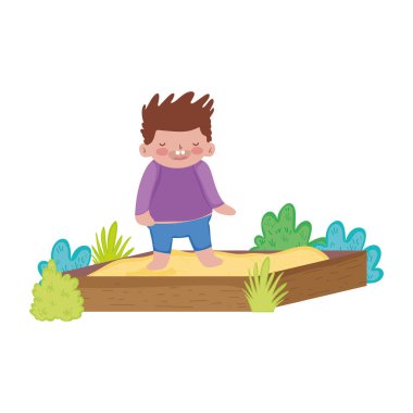 kum kutusunda oynayan küçük tombul çocuk