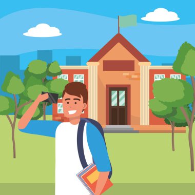 Kampüs arka planında akıllı telefon kullanan öğrenci