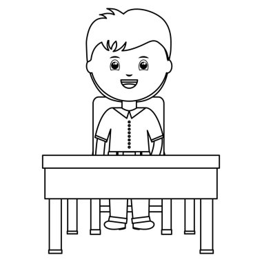 Okul masasında oturan sevimli küçük öğrenci çocuk