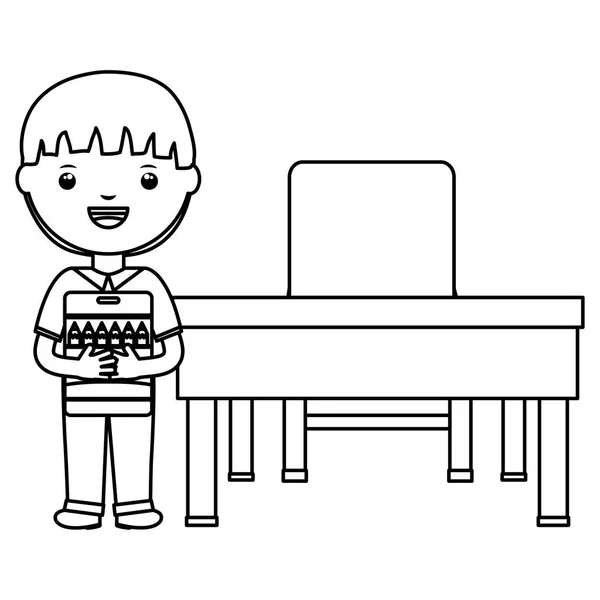 Bonito pouco estudante menino com cores lápis caixa no schooldesk —  Vetores de Stock