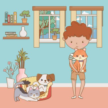 Kedileri ve çizgi film tasarımı olan bir çocuk.