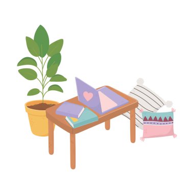 Dizüstü bilgisayarları, yastıkları ve saksısı olan güzel bir masa.