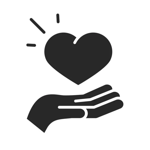 Dar charita dobrovolník pomoc sociální srdce v ruce silueta styl ikony — Stockový vektor