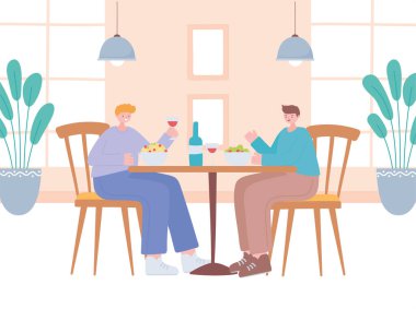 Restoran sosyal mesafesi, masa başında yemek yiyen erkekler, covid 19 salgını, koronavirüs enfeksiyonunun önlenmesi.