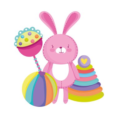 Küçük çocukların çizgi film oynaması için oyuncak. Pembe tavşan çıngırak topu ve piramit.