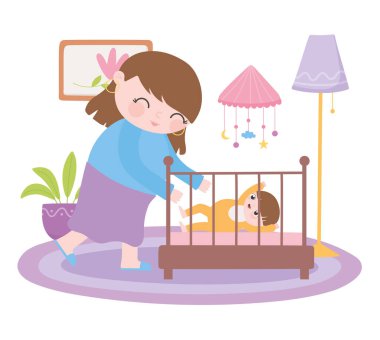 Hamilelik ve annelik, beşiğinde bebekle gülümseyen anne.