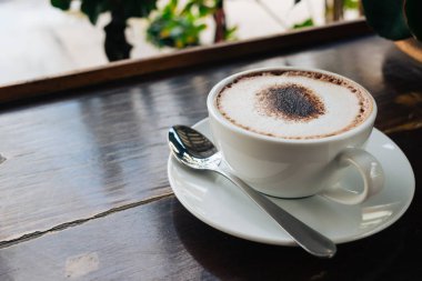 kahve fincanı vintage hareket tablo ahşap arka plan üzerinde