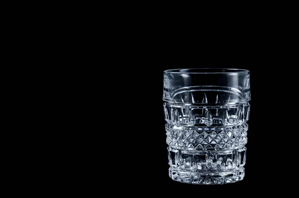 Faceted vintage glass on a black background, isolate . — Stock Photo, Image