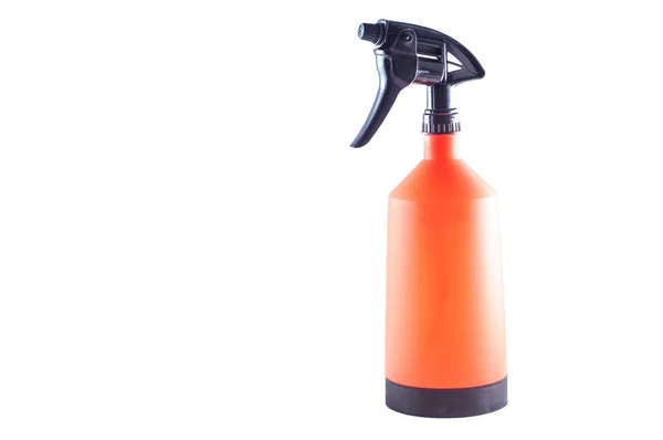 Spray the garden for care of plants. Bright orange capacity. On — Stock Photo, Image