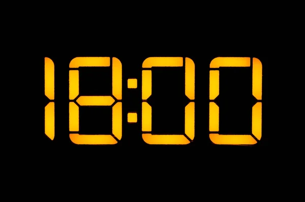 Relógio digital eletrônico com números laranja em um backgrou preto — Fotografia de Stock