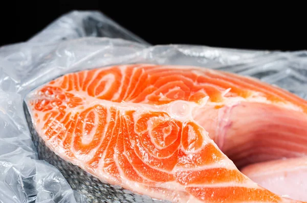 Close Large Salmon Steak Open Bag Black Background — Stockfoto