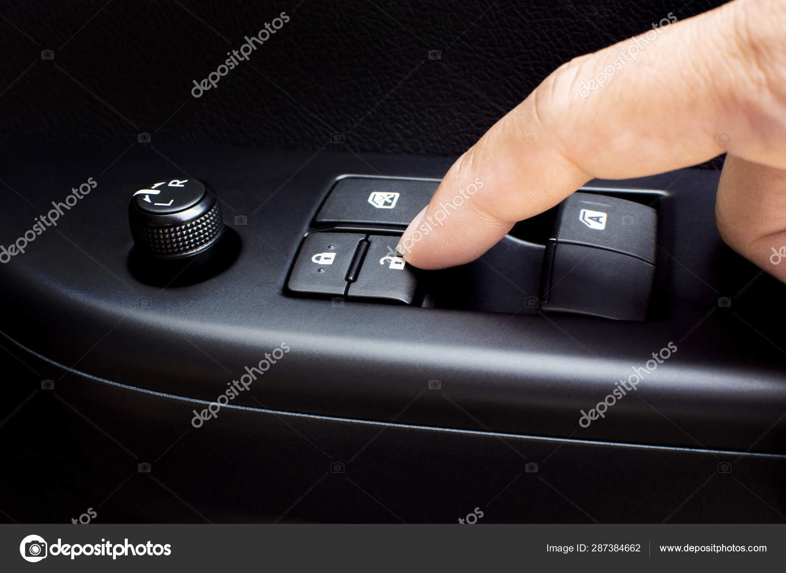 Finger Press The Car Door Unlock Button Stock Photo