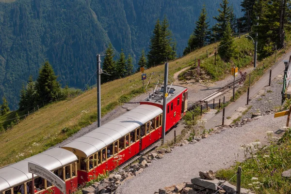 Tourist train down to the valley. Swiss Alps.