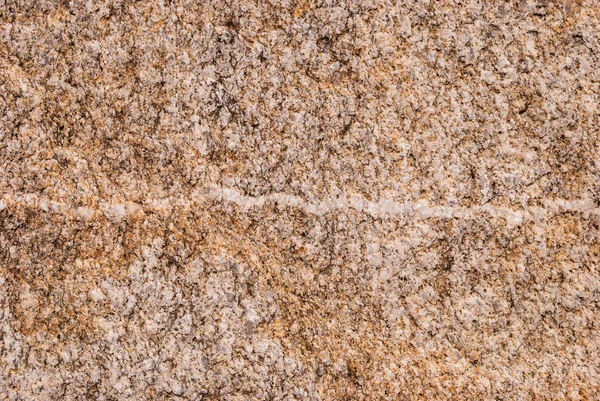 Natural granite stone with a unique pattern of inclusions of quartz veins.