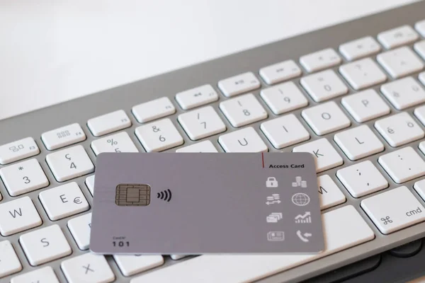 Close-up of access Bank card and computer keyboard.