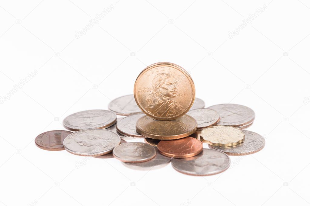 Pile of US coins isolated on white background