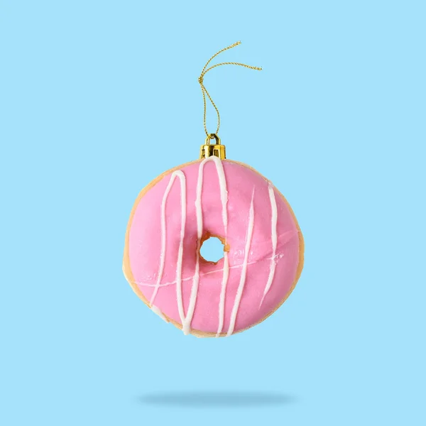 Christmas Bauble Decoration Made Pink Doughnut Blue Background Minimal Concept — Stock Photo, Image