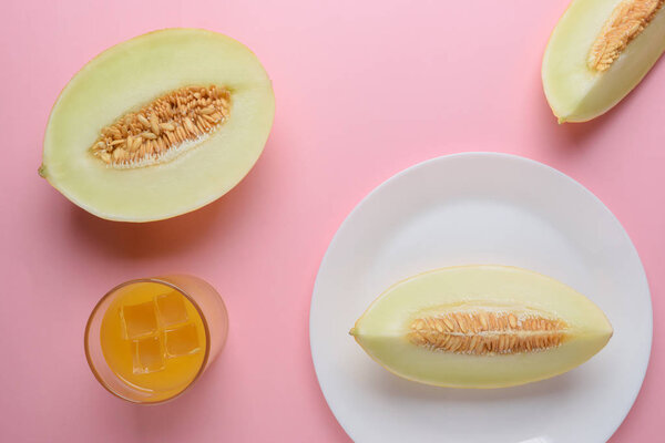 Melon sliced on pastel pink background. Minimal fruit concept.