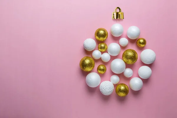Christmas bauble made of gold and white glitter balls. Minimal New Year or Christmas concept. Flat lay.