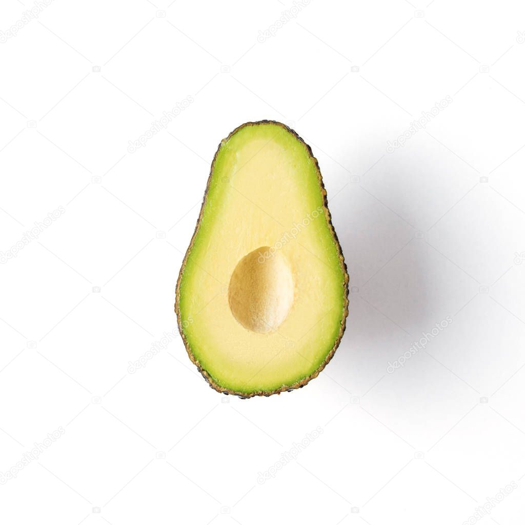 Sliced avocado isolated on white background. Minimal concept.