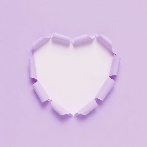 Vivid torn paper heart on bright background. Minimal love or like concept. Flat lay.
