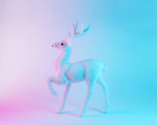 White reindeer in vibrant bold gradient holographic colors. Christmas and New Year minimal art concept. — Stock Photo, Image