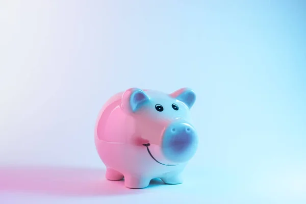Piggy bank in vibrant bold gradient holographic colors. Christmas and New Year minimal art concept. — Stock Photo, Image