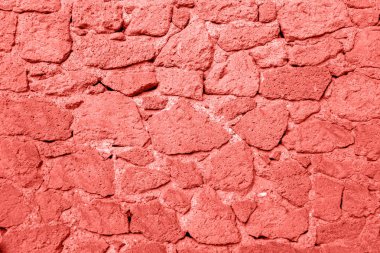 Taş duvar dokulu arka plan. Mercan renk kavramı.