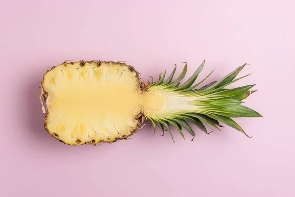 Creative composition with sliced pineapple on bright background. Creative minimal summer concept.