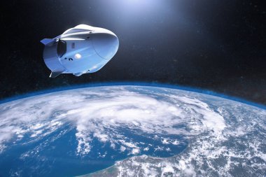 Alçak Dünya yörüngesinde kargo uzay aracı. Bu görüntünün elementleri NASA tarafından desteklenmektedir.