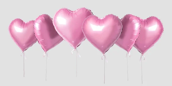 Manojo de globos de papel de aluminio en forma de corazón de color rosa aislados sobre un fondo brillante. Concepto de amor mínimo . —  Fotos de Stock